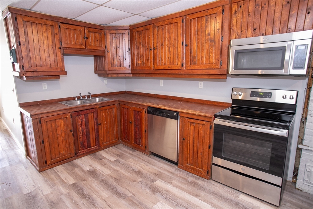 865 South Barre Road Barre, MA 01074 - Photo 21 of 34 a kitchen with stainless steel appliances granite countertop wooden cabinets a stove and a sink