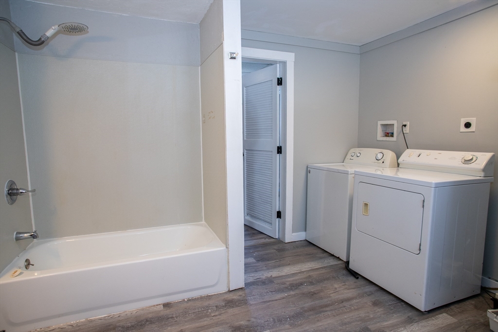 865 South Barre Road Barre, MA 01074 - Photo 25 of 34 a bathroom with a tub a sink and mirror