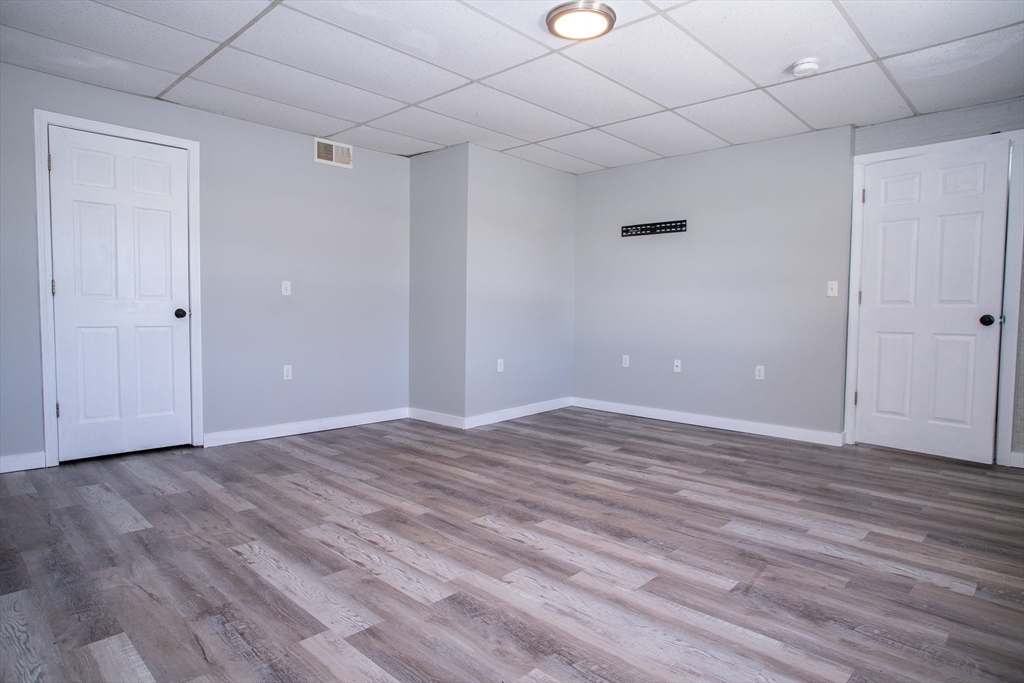 865 South Barre Road Barre, MA 01074 - Photo 29 of 34 a view of an empty room with wooden floor