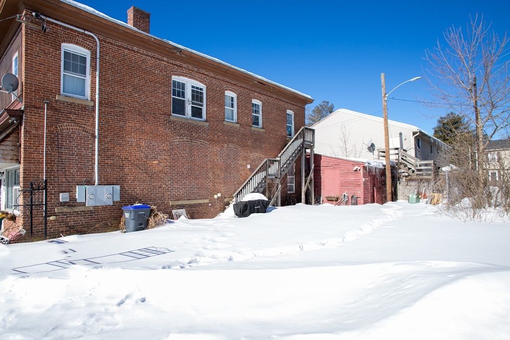 865 South Barre Road Barre, MA 01074 - Photo 5 of 34 a view of a house with snow on the road