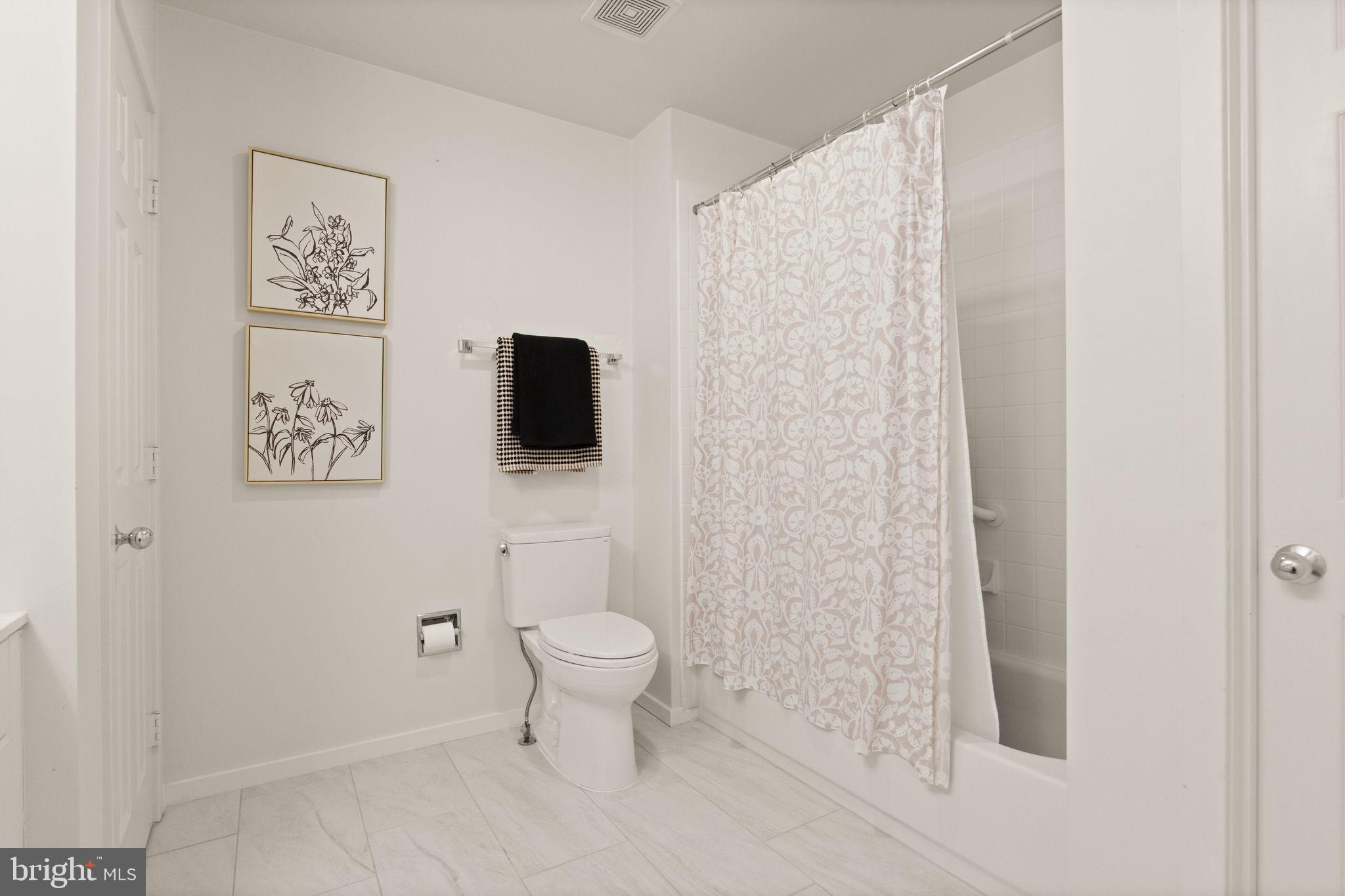 1424 Belcastle Court Reston, VA 20194 - Photo 25 of 33 Tub shower combo and interior linen closet