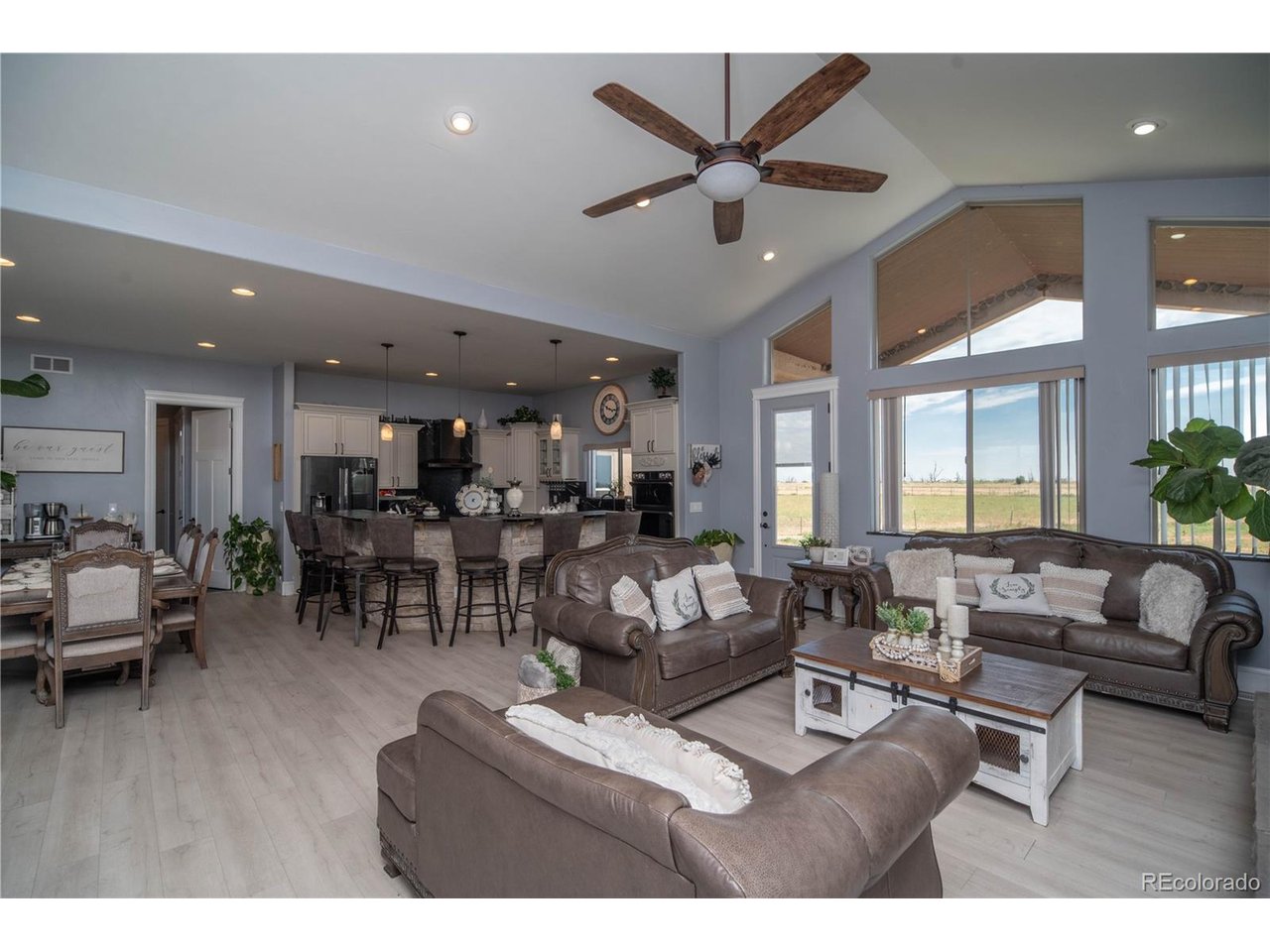9368 41st Fort Fort Lupton, CO 80621 - Photo 11 of 44 a living room with furniture and a large window