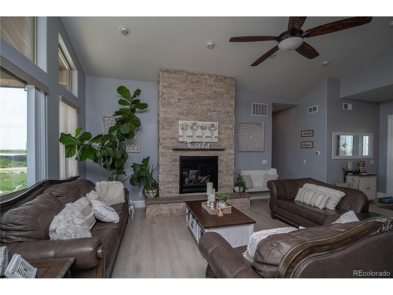 9368 41st Fort Fort Lupton, CO 80621 - Photo 15 of 44 a living room with furniture and a fireplace