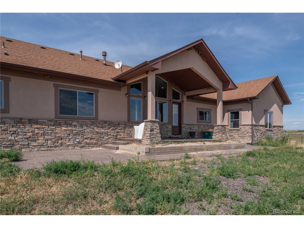 9368 41st Fort Fort Lupton, CO 80621 - Photo 2 of 44 a front view of a house with garden