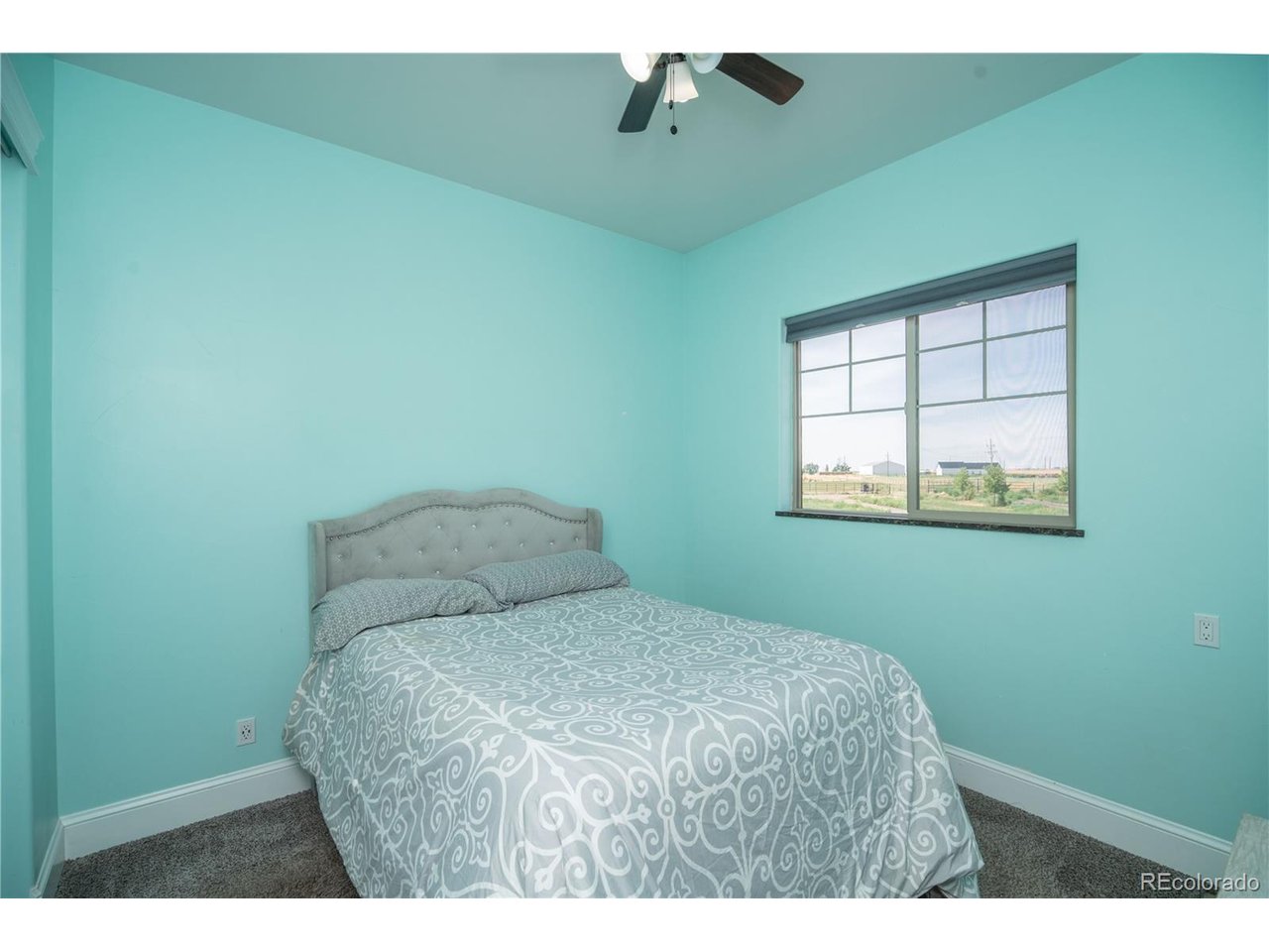 9368 41st Fort Fort Lupton, CO 80621 - Photo 27 of 44 a bedroom with a bed and a window