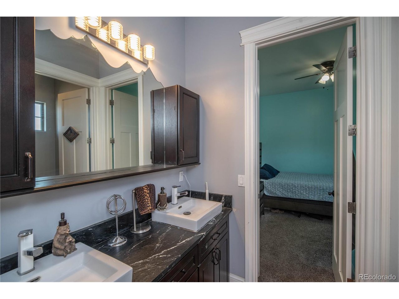9368 41st Fort Fort Lupton, CO 80621 - Photo 29 of 44 a bathroom with a sink and a mirror