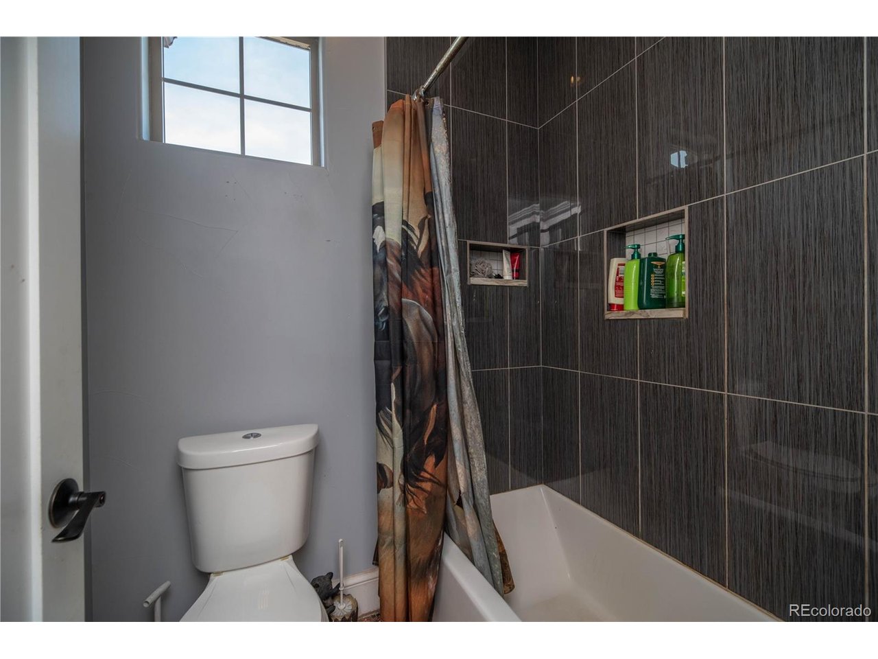 9368 41st Fort Fort Lupton, CO 80621 - Photo 30 of 44 a bathroom with a toilet a sink and mirror