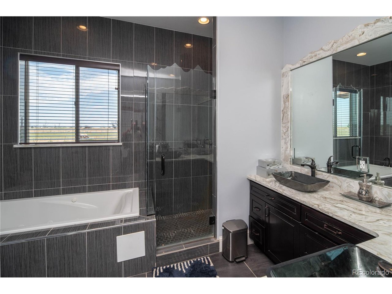 9368 41st Fort Fort Lupton, CO 80621 - Photo 31 of 44 a bathroom with a sink a toilet and shower