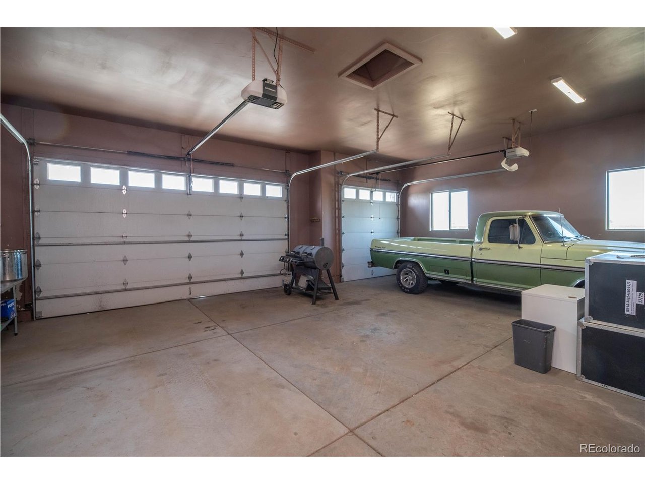 9368 41st Fort Fort Lupton, CO 80621 - Photo 33 of 44 a view of a livingroom with furniture and a projector