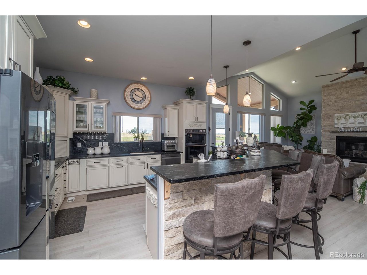 9368 41st Fort Fort Lupton, CO 80621 - Photo 6 of 44 a large kitchen with a table and chairs