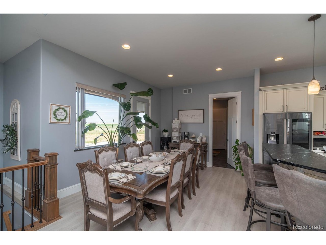 9368 41st Fort Fort Lupton, CO 80621 - Photo 8 of 44 a view of a dining room with furniture and window