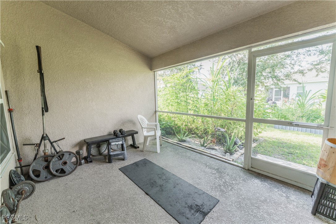 5134 Baron Street Lehigh Acres, FL 33971 - Photo 12 of 30 a view of a room with gym equipment