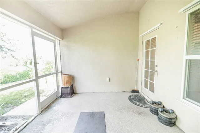 a room with a bed and wooden floor