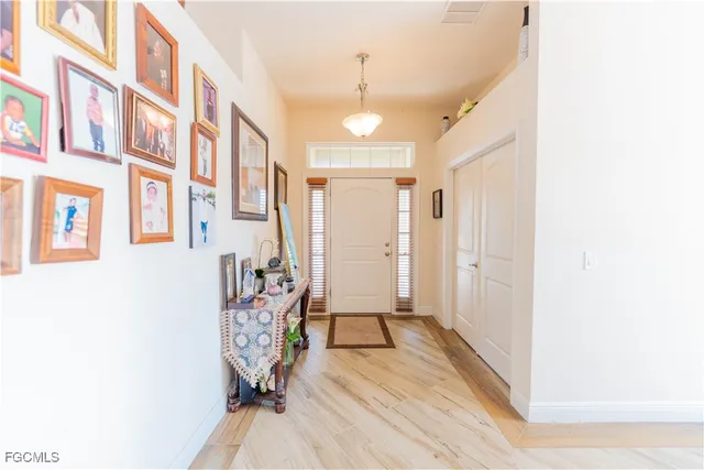 a view of an entryway with wooden floor