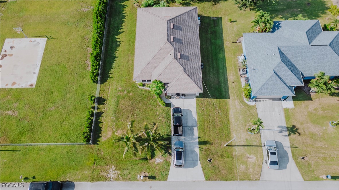 5134 Baron Street Lehigh Acres, FL 33971 - Photo 21 of 30 an aerial view of a house with a garden