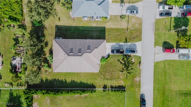 an aerial view of a house with a lake view