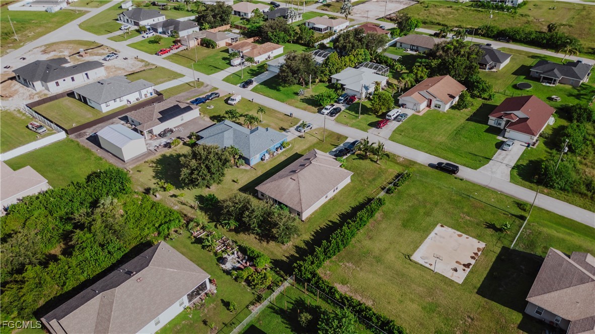 5134 Baron Street Lehigh Acres, FL 33971 - Photo 24 of 30 an aerial view of a house with a garden