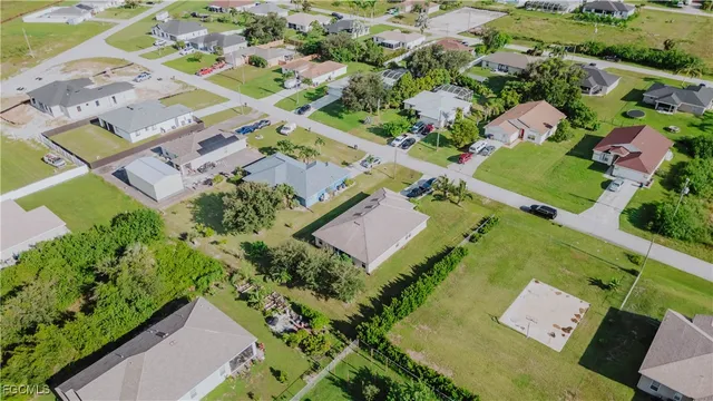 an aerial view of a house with a garden