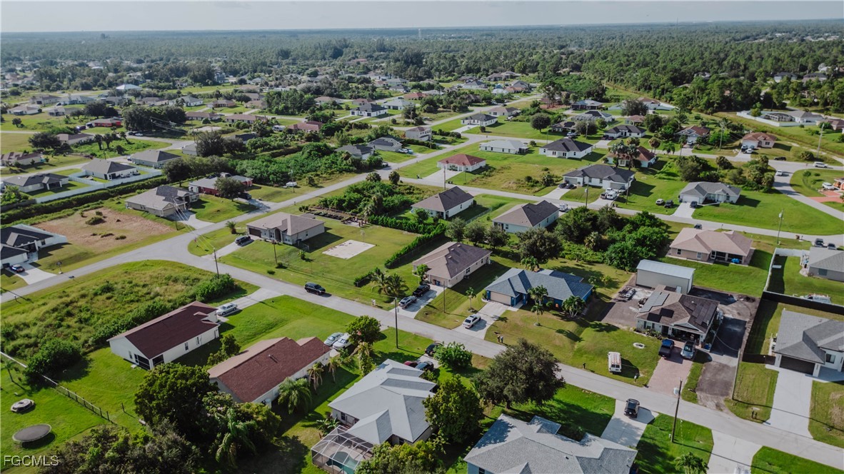 5134 Baron Street Lehigh Acres, FL 33971 - Photo 29 of 30 an aerial view of residential houses with outdoor space