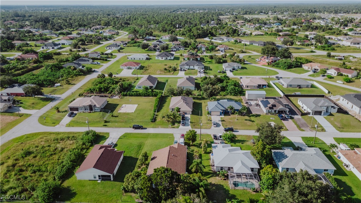 5134 Baron Street Lehigh Acres, FL 33971 - Photo 30 of 30 an aerial view of residential houses with outdoor space