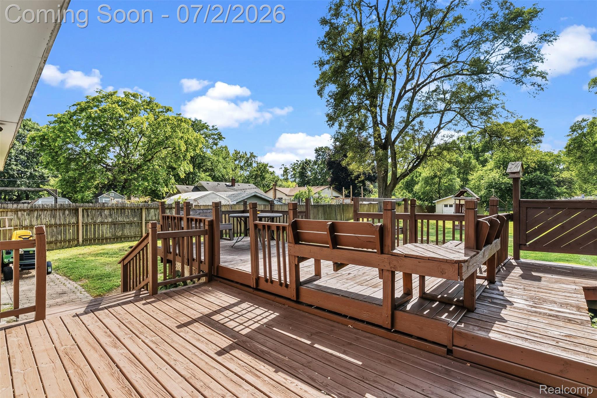 305 East Road Holly, MI 48442 - Photo 34 of 41 Multi-level wood deck featuring built-in seating and stairs