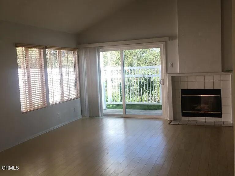 809 Vista Arriago Camarillo, CA 93012 - Photo 5 of 11 a view of empty room with wooden floor and fireplace