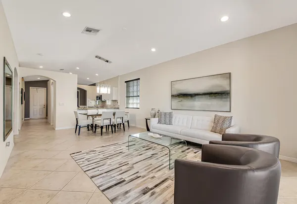 a living room with furniture and a table