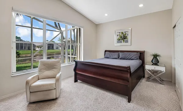 a bedroom with a bed and a couch