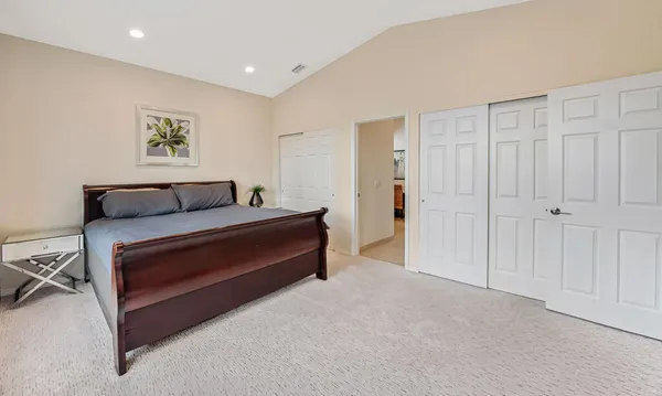 a bedroom with a bed and a furniture