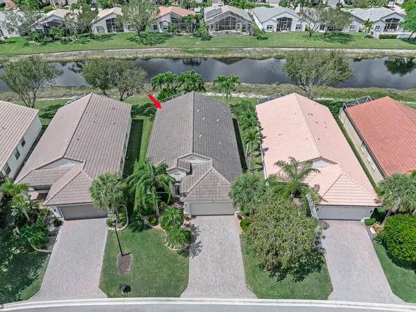 an aerial view of a house with a lake view