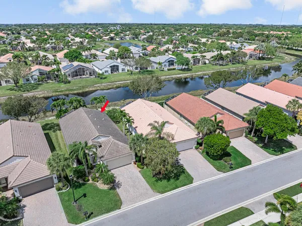 an aerial view of residential houses with outdoor space and street view