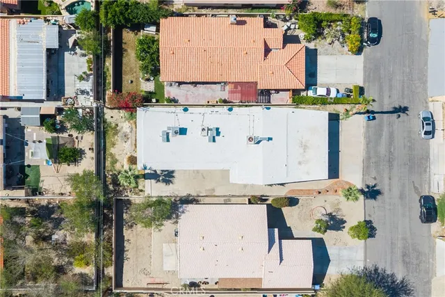 an aerial view of residential houses with outdoor space