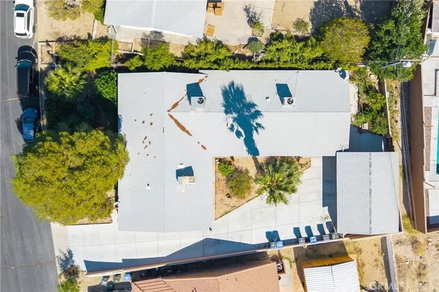 an aerial view of a house with a swimming pool