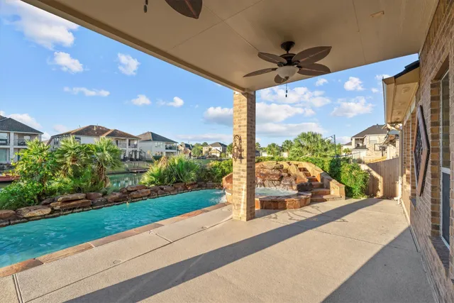 a view of a floor to ceiling window and a yard