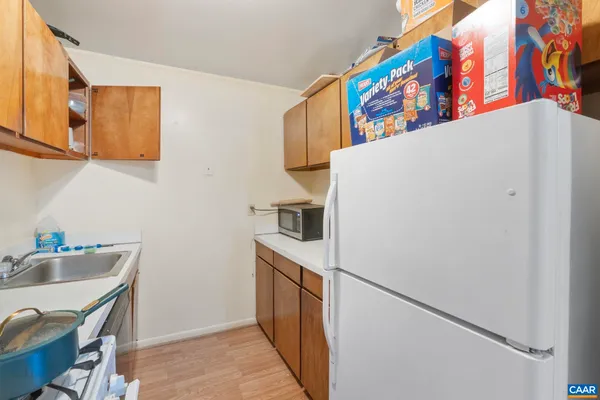a white refrigerator freezer sitting inside of a kitchen