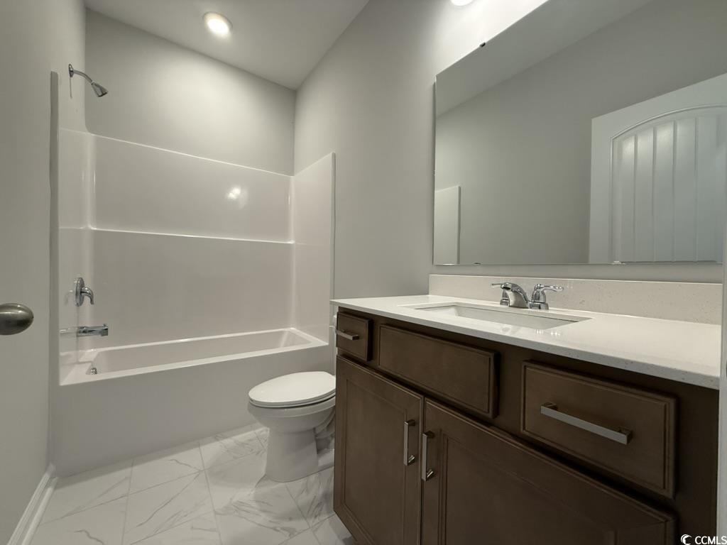 439 Kapalua Loop Little River, SC 29566 - Photo 20 of 36 Full bathroom featuring vanity, shower / washtub combination, and marble look tile flooring