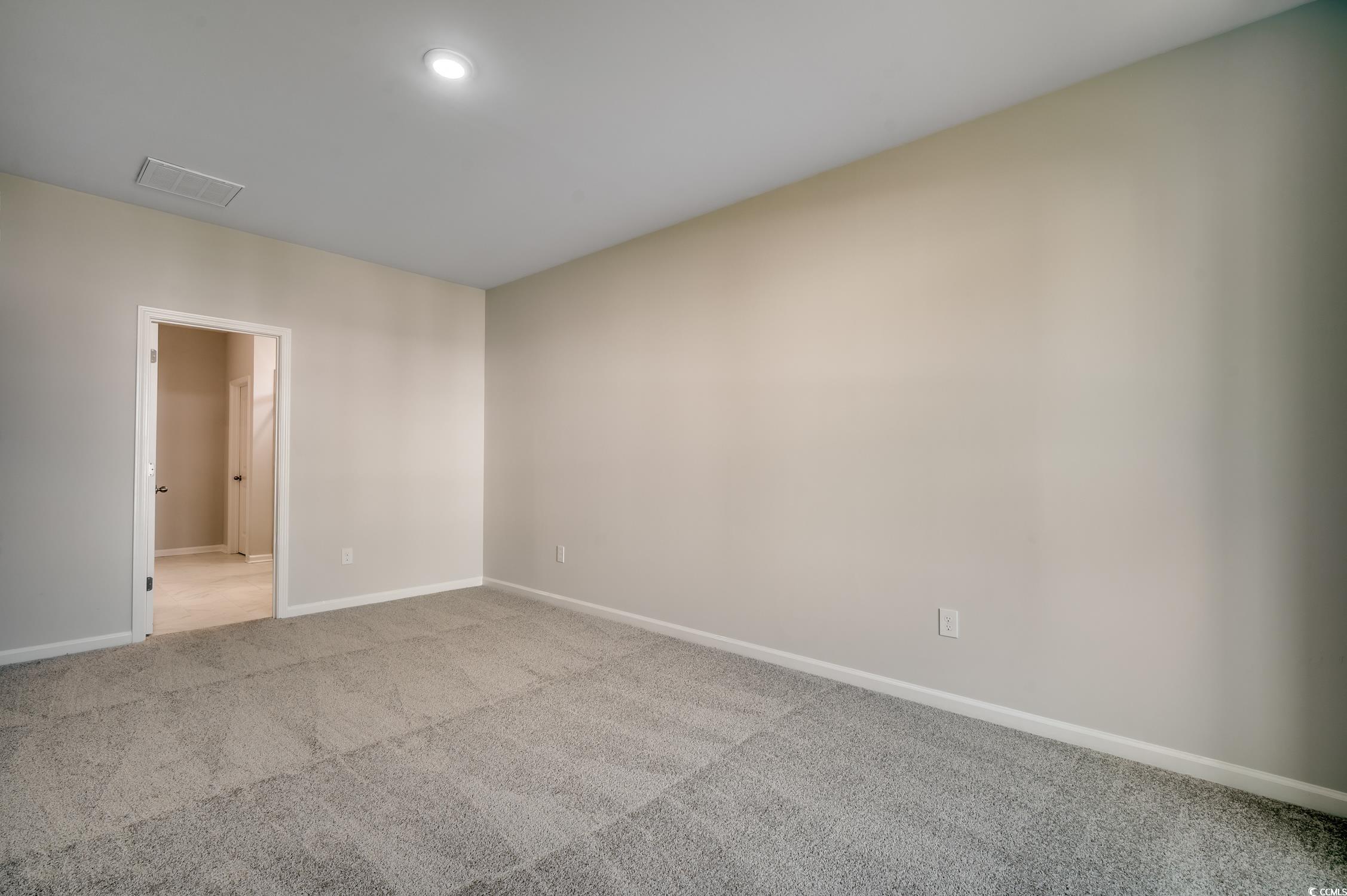 439 Kapalua Loop Little River, SC 29566 - Photo 21 of 36 Unfurnished room with carpet flooring and baseboards
