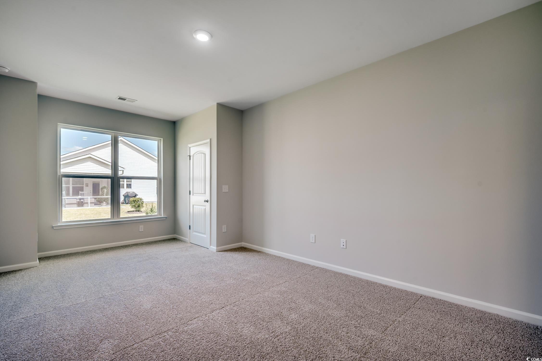 439 Kapalua Loop Little River, SC 29566 - Photo 22 of 36 Empty room with carpet and baseboards