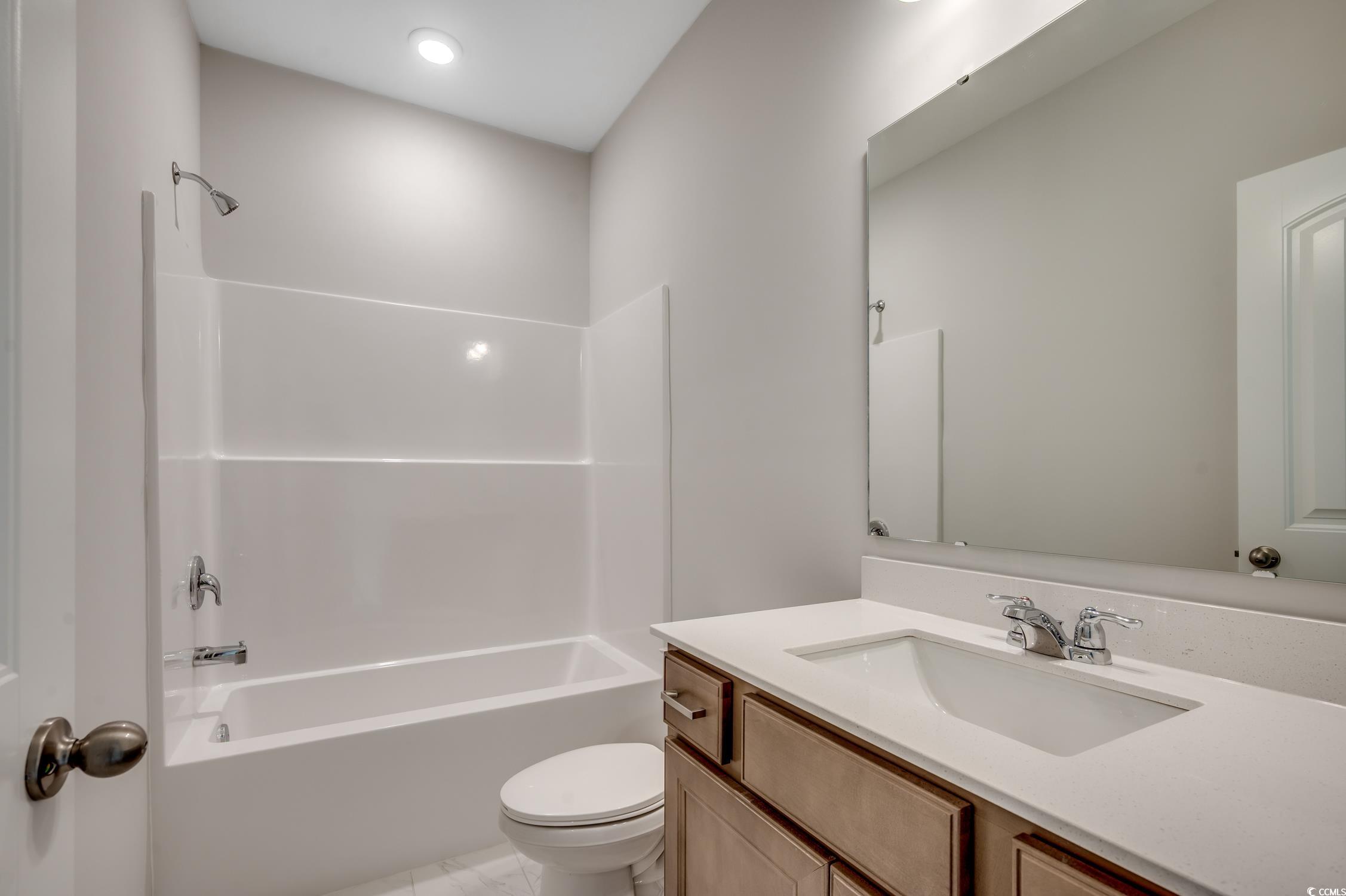 439 Kapalua Loop Little River, SC 29566 - Photo 29 of 36 Bathroom with shower / washtub combination, vanity, and light tile patterned flooring