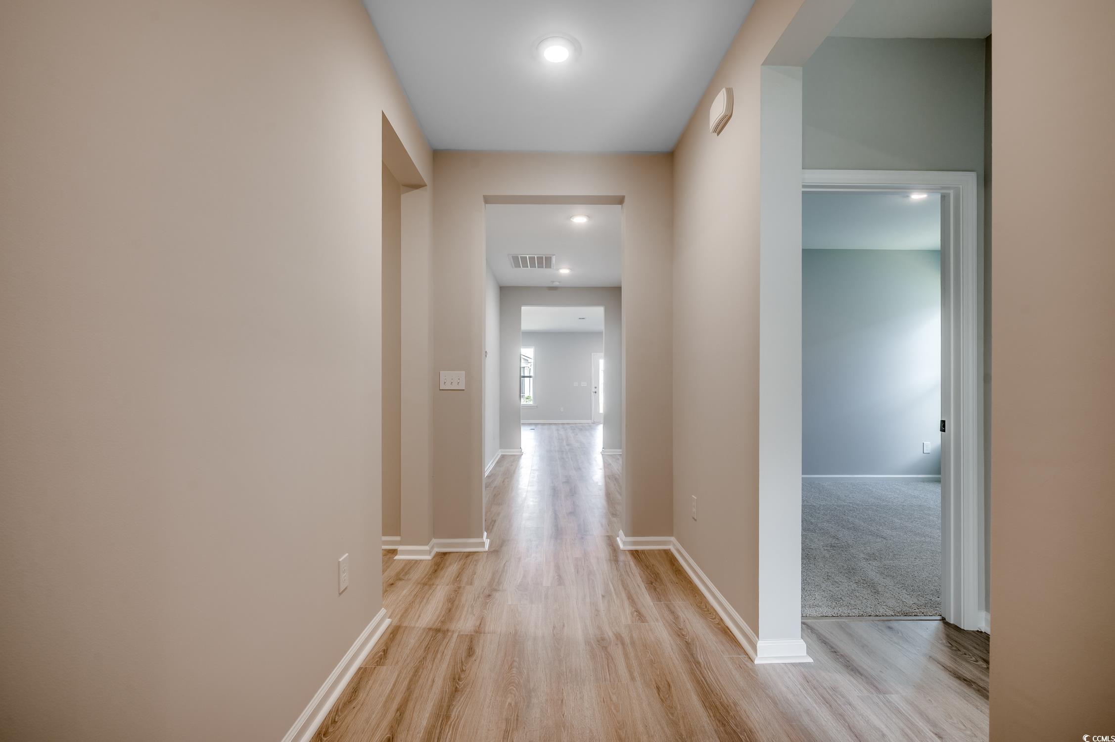 439 Kapalua Loop Little River, SC 29566 - Photo 3 of 36 Corridor with light wood-style flooring and recessed lighting