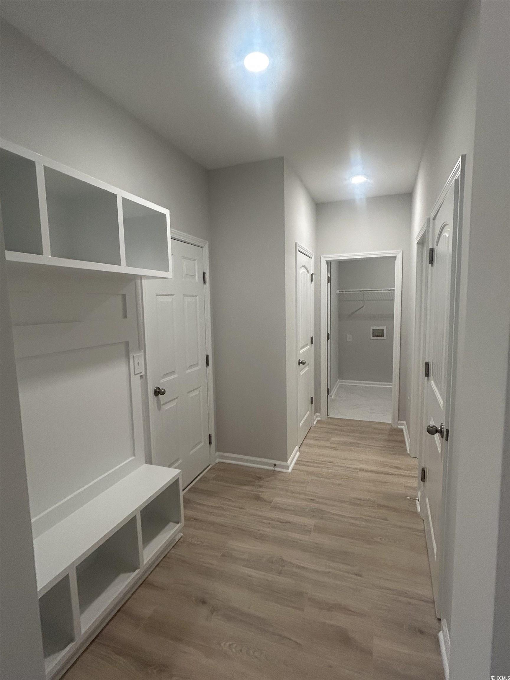 439 Kapalua Loop Little River, SC 29566 - Photo 6 of 36 Mudroom featuring wood finished floors and baseboards