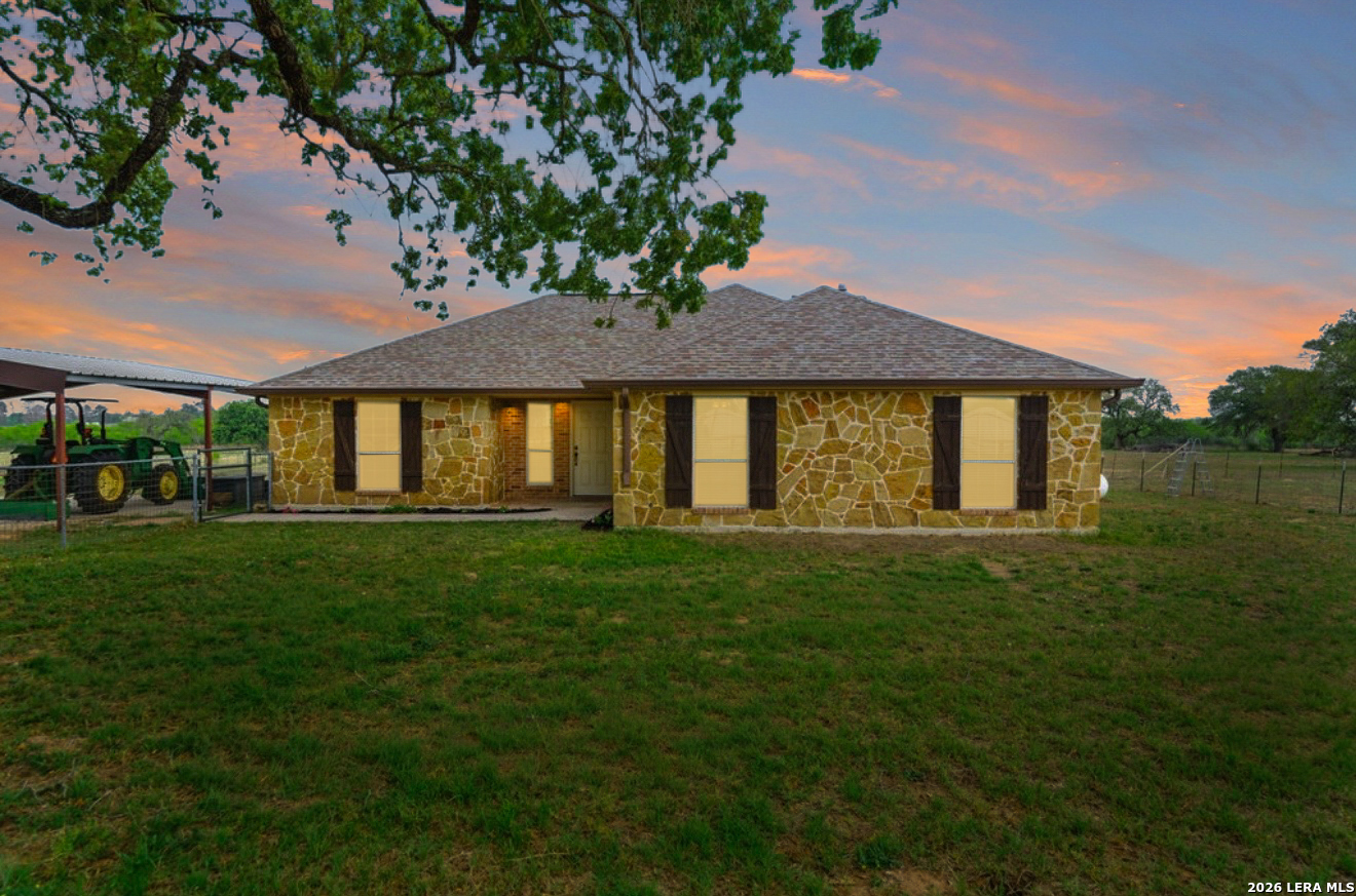 12897 La Vernia Road St. Hedwig, TX 78152 - Photo 34 of 34 a front view of a house with a garden