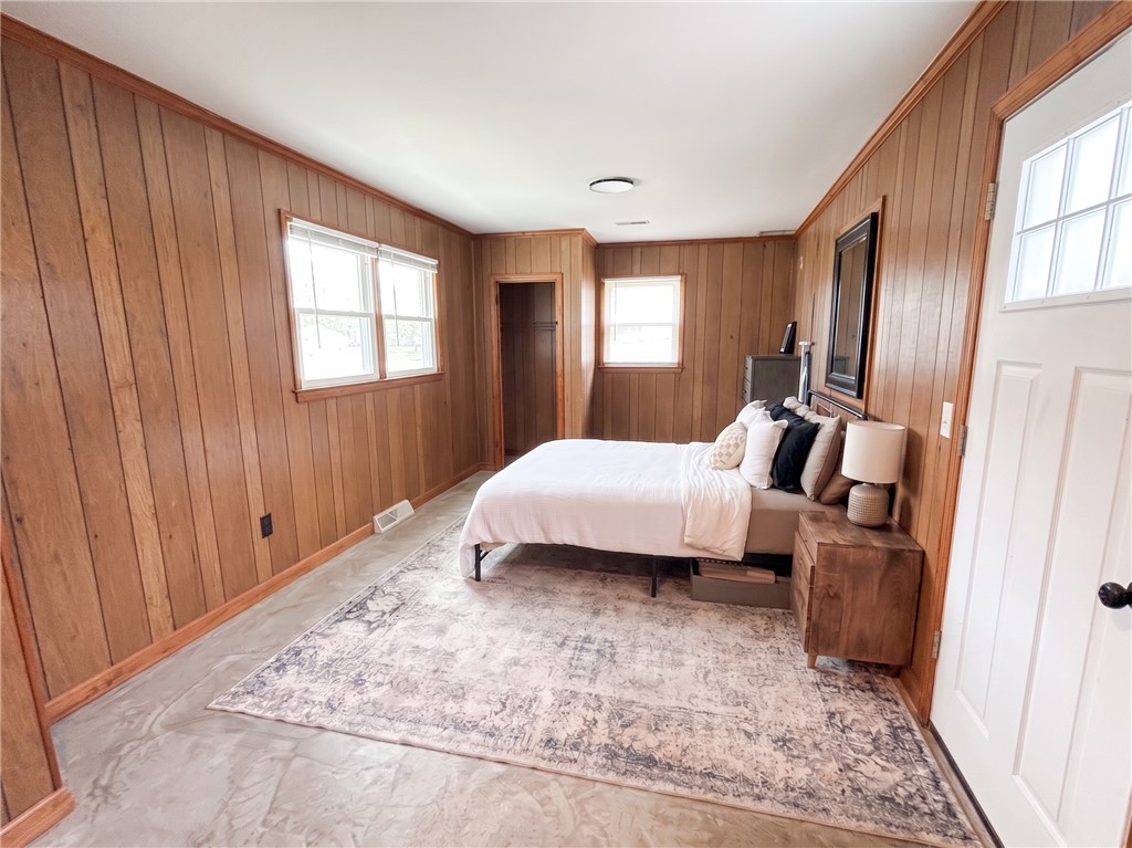 710 O Neal Street Belton, SC 29627 - Photo 11 of 18 Hardwood paneling provides a warm ambiance in this private bedroom retreat.