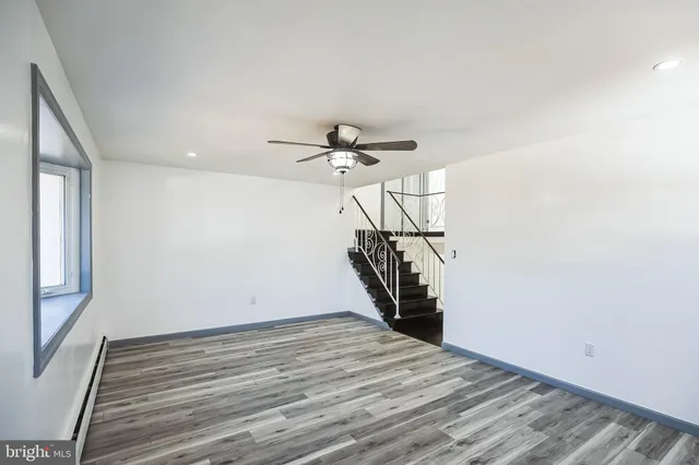 a view of entryway and hall with a chandelier