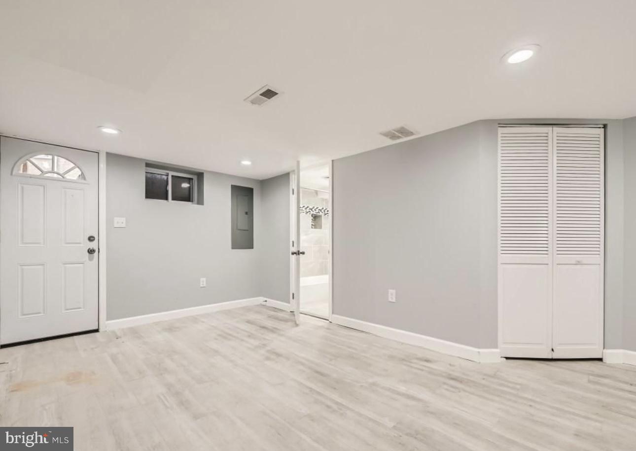 905 East Patapsco Avenue Baltimore, MD 21225 - Photo 15 of 25 a view of an empty room with wooden floor and closet