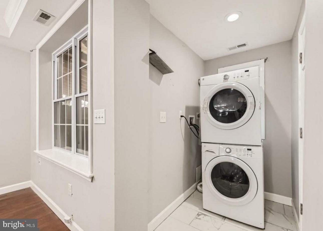 905 East Patapsco Avenue Baltimore, MD 21225 - Photo 21 of 25 a view of a hallway with washer and dryer