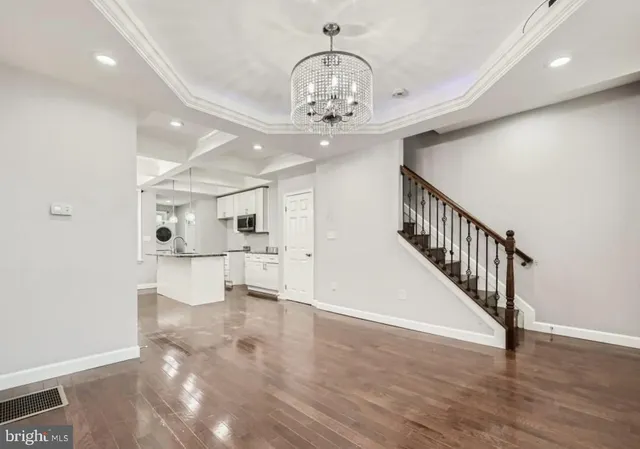 a view of an entryway with wooden floor