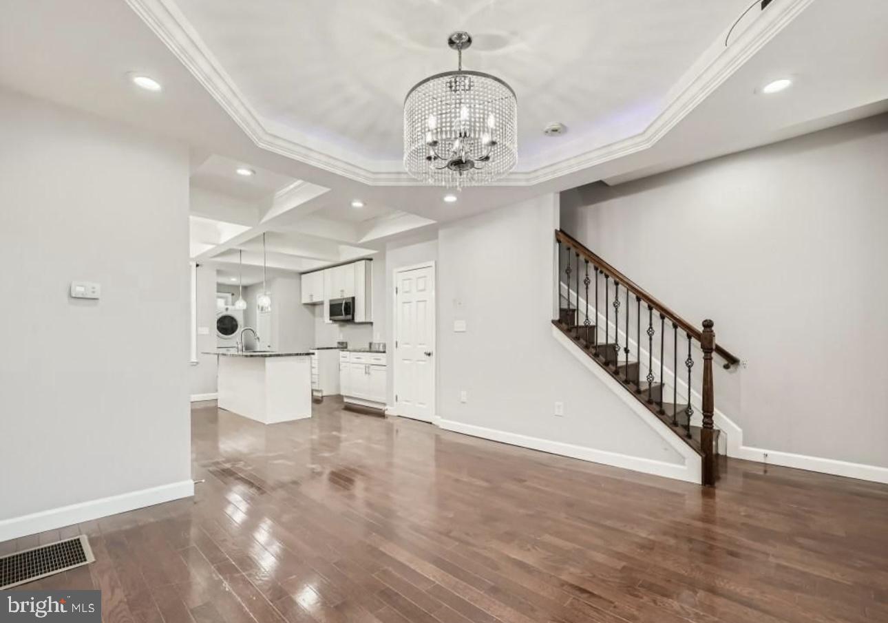 905 East Patapsco Avenue Baltimore, MD 21225 - Photo 4 of 25 a view of an entryway with wooden floor