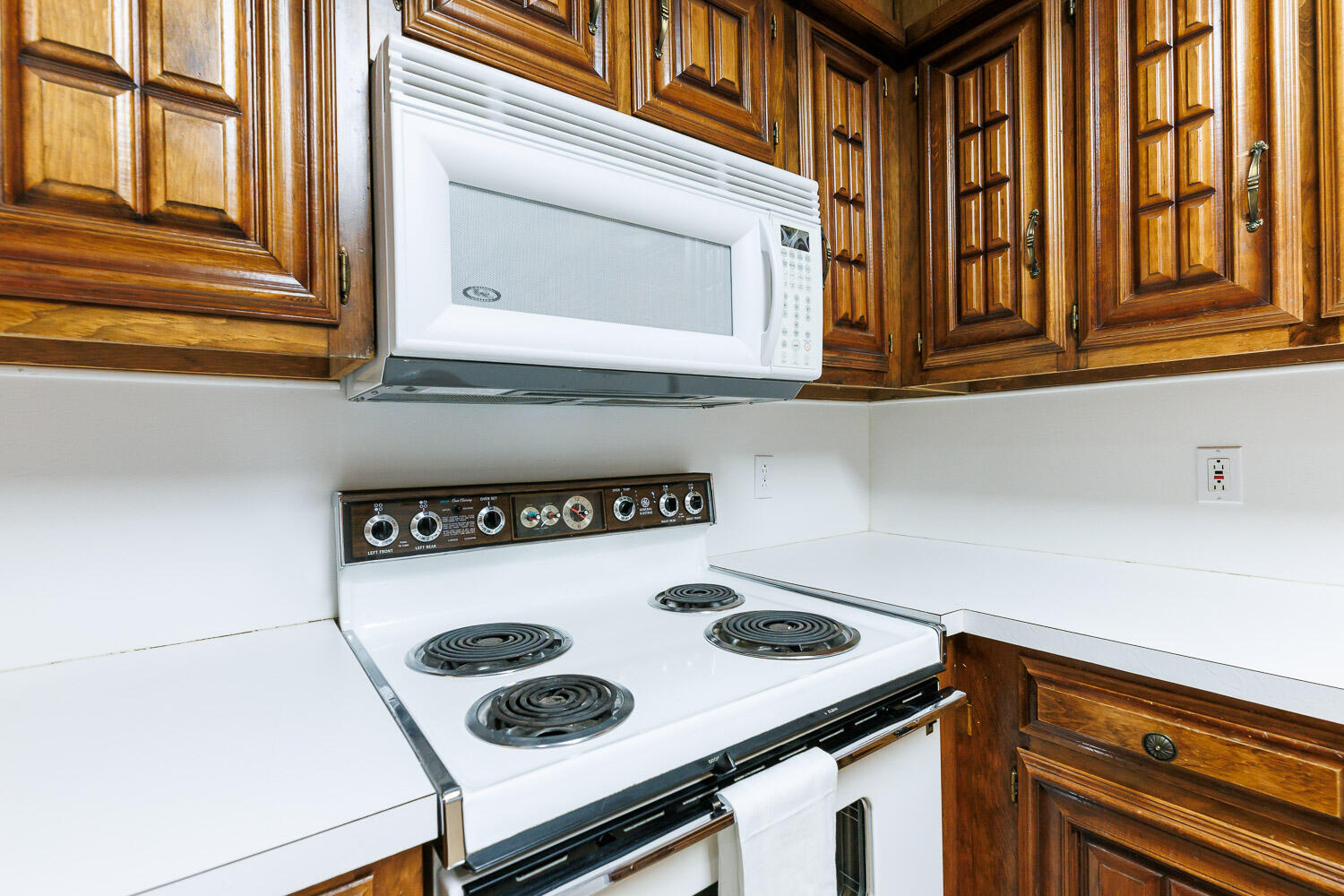 5717 72nd Street Lubbock, TX 79424 - Photo 16 of 54 a kitchen with a stove and a microwave