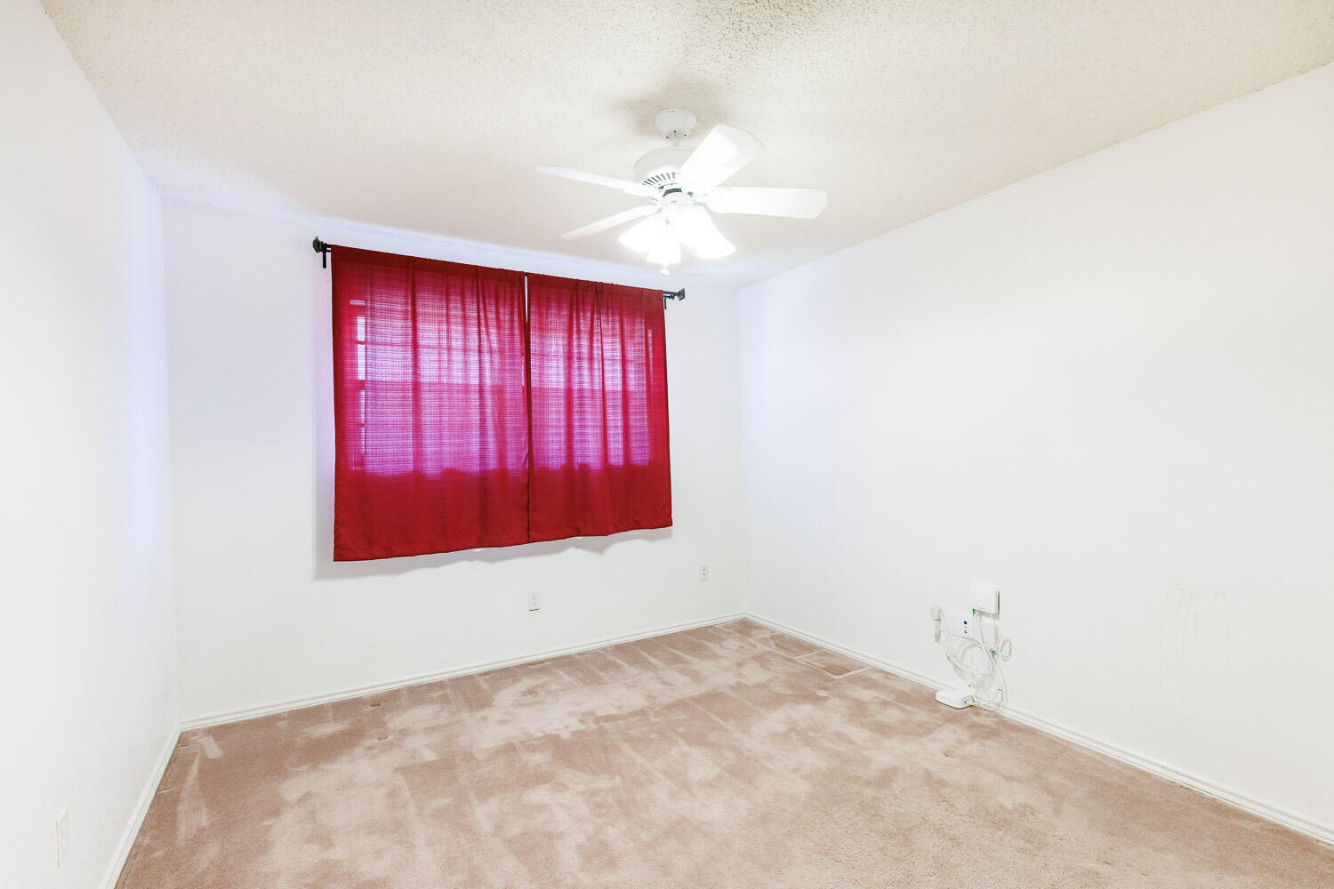 5717 72nd Street Lubbock, TX 79424 - Photo 37 of 54 an empty room with windows and fan